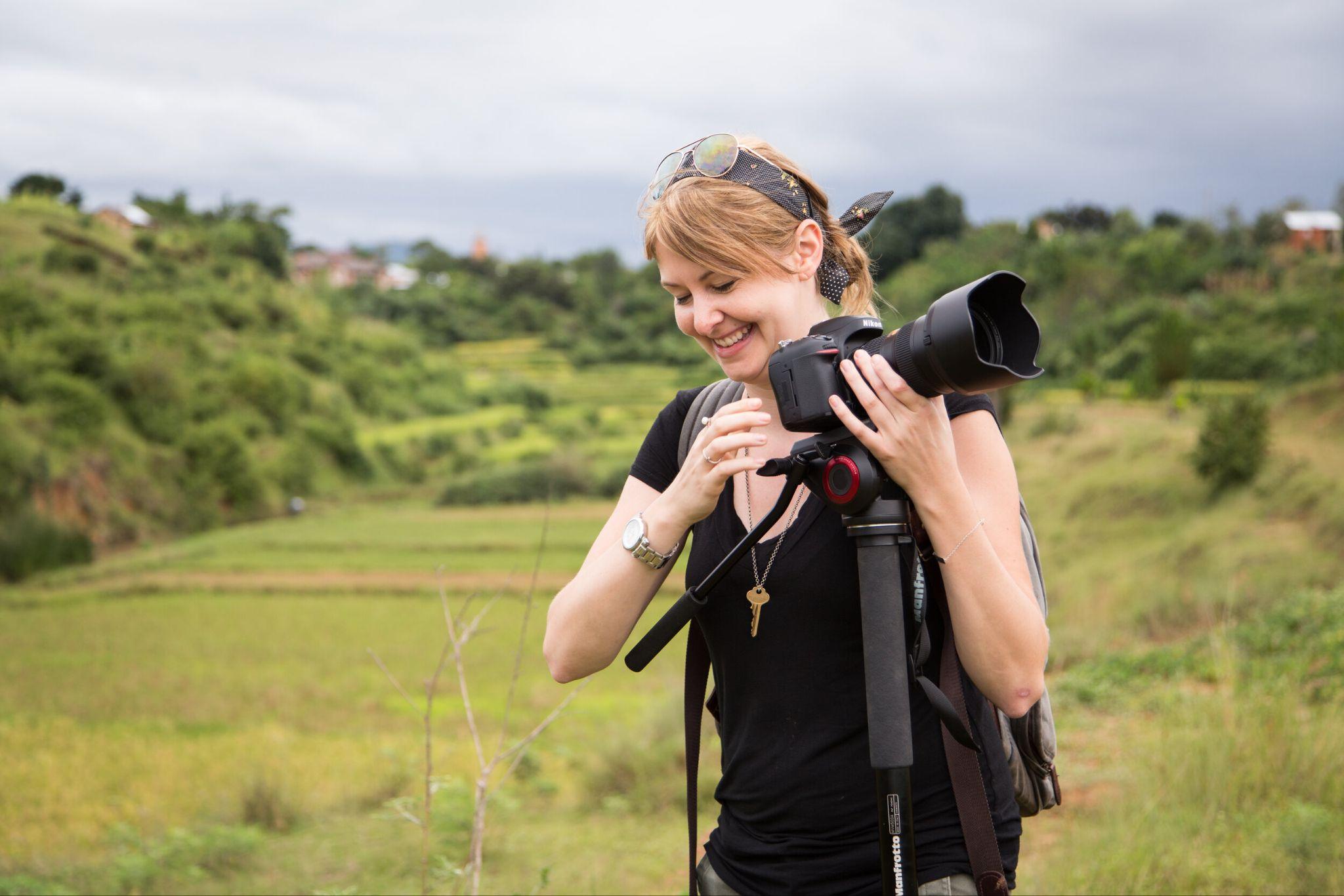 Kristi filming with a camera in the Madagascar highlands